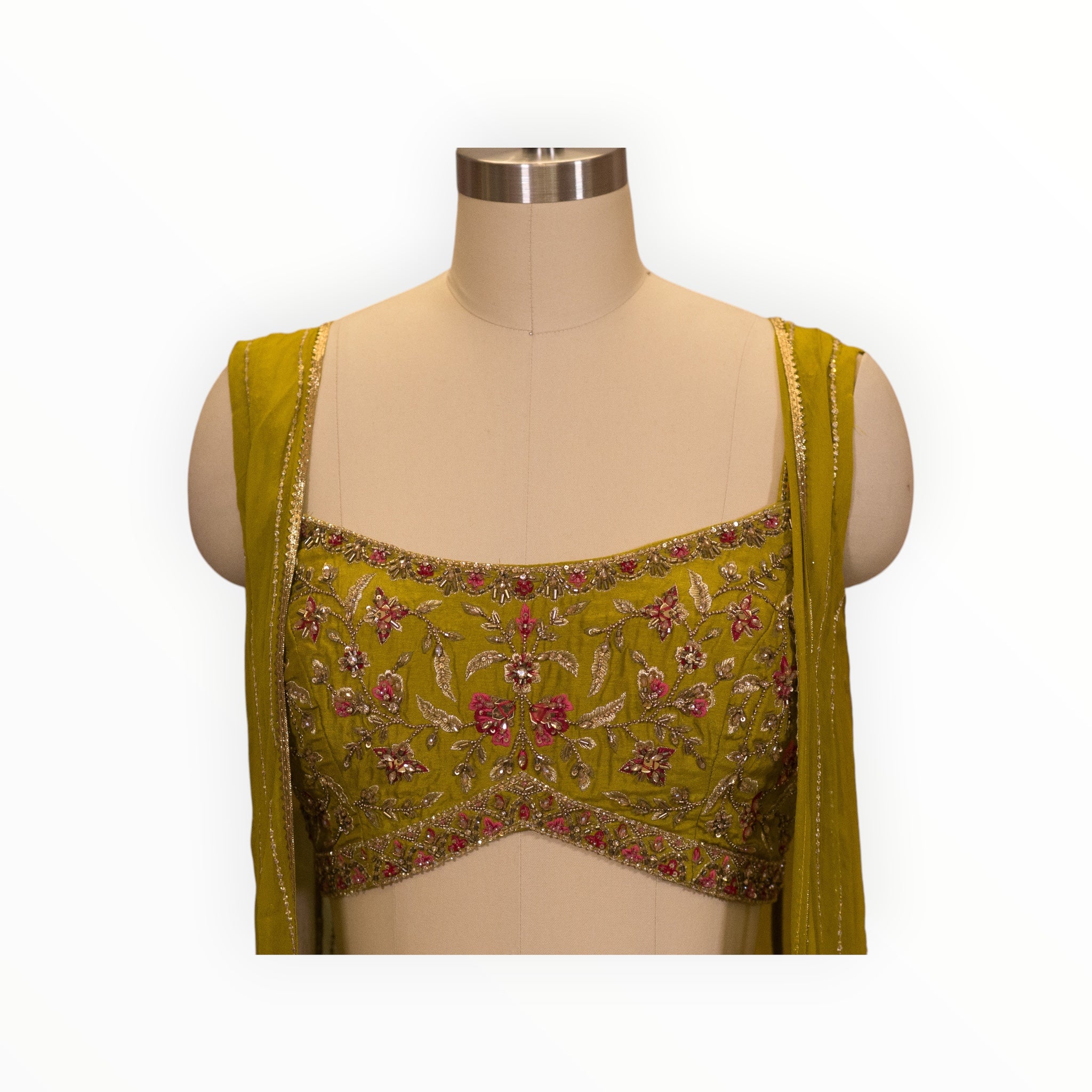 Zari Designs olive green drape saree blouse with intricate floral embroidery and gold beadwork on a mannequin