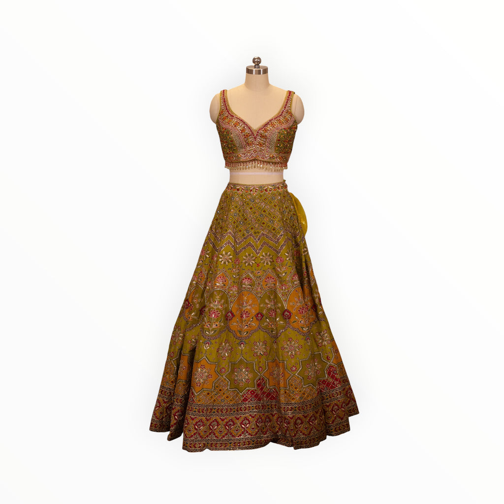 Zari Designs Carnival Lehnga in olive green with intricate multi-colored floral embroidery and beadwork on a mannequin