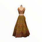 Zari Designs Carnival Lehnga in olive green with intricate multi-colored floral embroidery and beadwork on a mannequin
