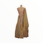 Zari Designs peach and mint green embroidered lehenga choli with mirror work and sheer dupatta on a mannequin