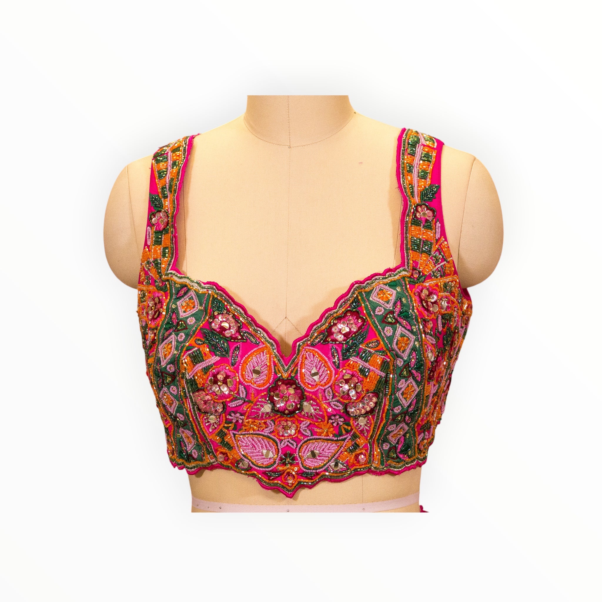 Zari Designs Carnival Lehnga blouse in vibrant pink with intricate multi-colored floral embroidery and beadwork