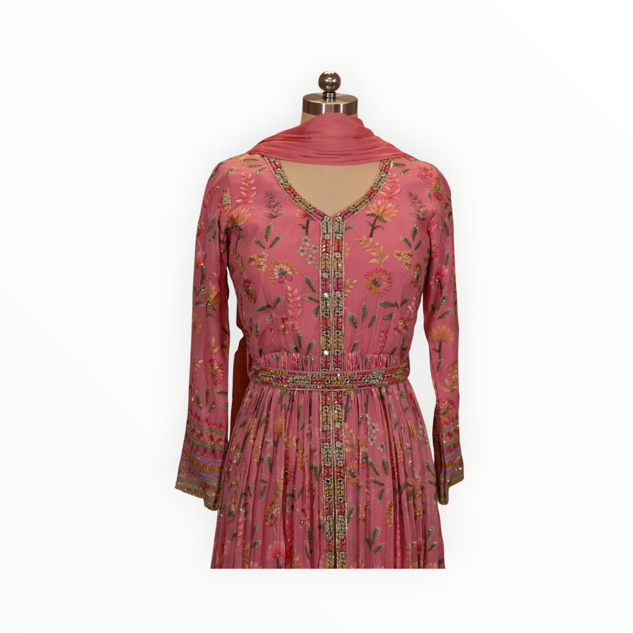 Zari Designs pink floral Anarkali dress with intricate embroidery, mirror work, and a matching dupatta on a mannequin