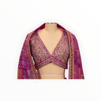Zari Designs Carnival Lehnga featuring a deep pink blouse with intricate mirror work and embroidery on a mannequin