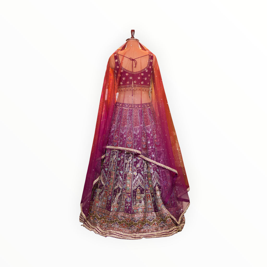 Zari Designs purple Banarsi lehenga with intricate silver embroidery, sequins, and a sheer matching dupatta on a mannequin