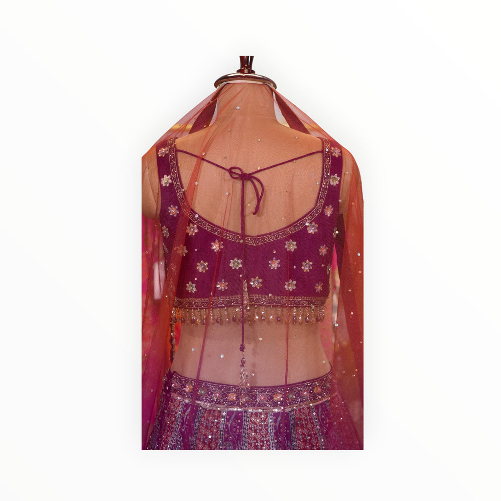 Zari Designs purple Banarsi lehnga blouse with intricate floral embroidery, sequins, and a sheer red dupatta back view