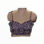 Zari Designs purple sleeveless blouse with intricate white and gold beadwork and sequin embellishments on a mannequin