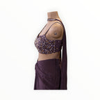 Zari Designs purple ready-to-wear saree featuring a sleeveless blouse with intricate bead and sequin embroidery.