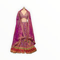 Zari Designs purple Carnival Lehnga with intricate gold embroidery, mirror work, and a matching sheer dupatta.