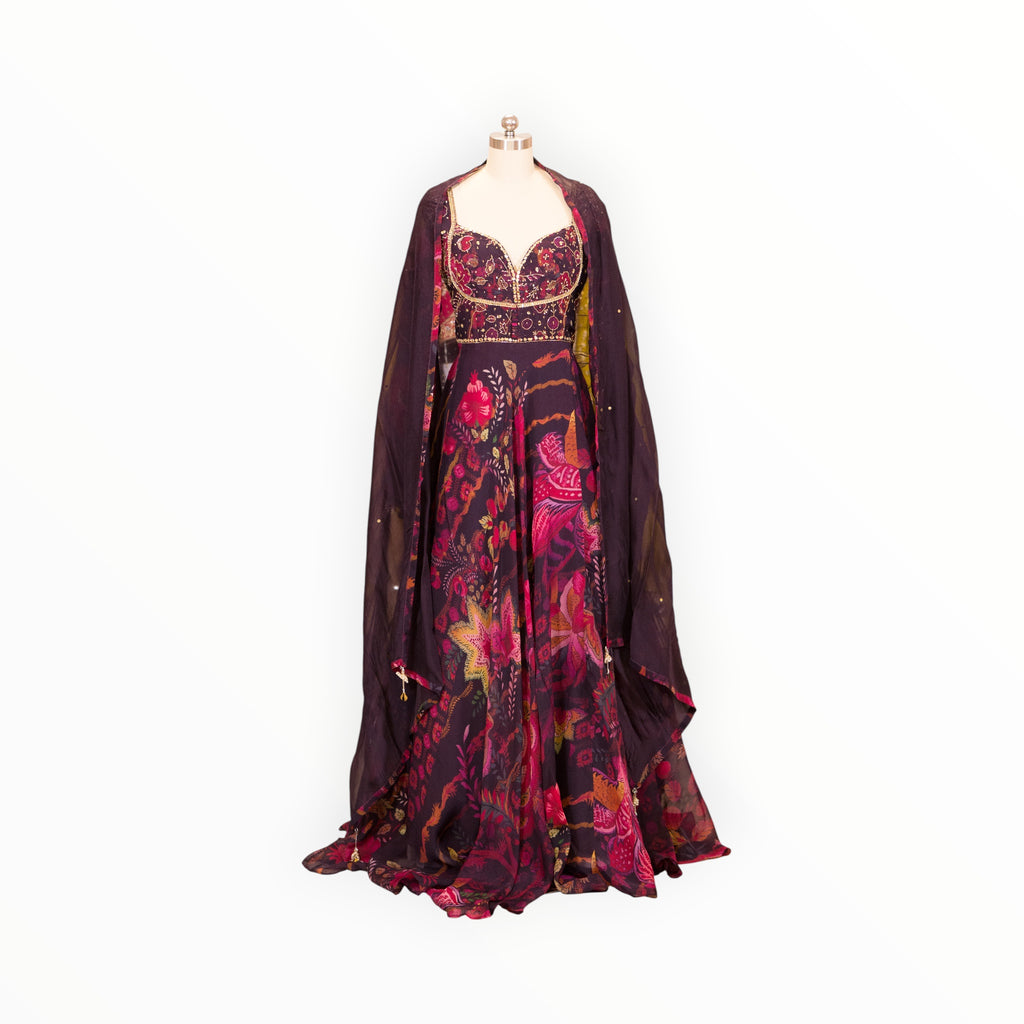 Zari Designs Anarkali VRST3008 featuring a deep purple floral print gown with a matching sheer cape overlay
