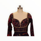 Zari Designs Anarkali dress featuring a deep purple floral print, sweetheart neckline, and intricate gold embroidery.