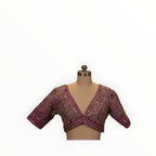 Zari Designs purple Carnival Lehnga blouse with intricate silver embroidery and mirror work on a mannequin