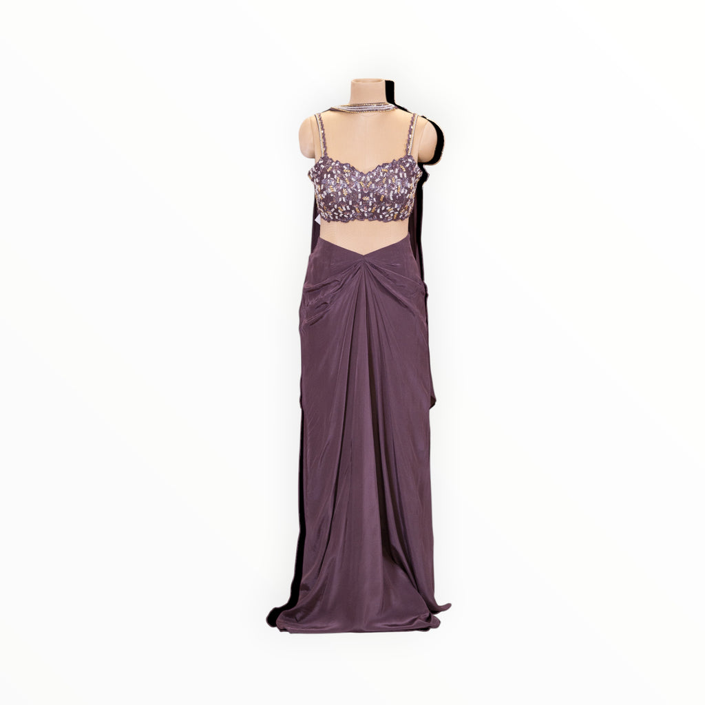 Zari Designs purple ready-to-wear saree with a sleeveless, heavily embellished sequin blouse on a mannequin.