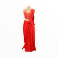 Zari Designs red ready-to-wear saree with a sleeveless embellished blouse and ruffled drape on a mannequin
