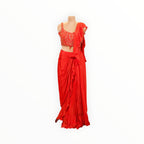 Zari Designs red ready-to-wear saree with a sleeveless embellished blouse and ruffled drape on a mannequin