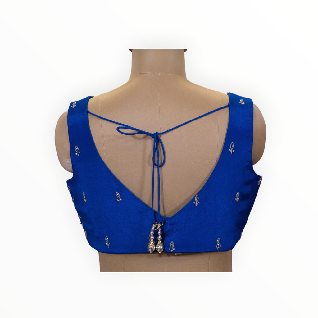 Zari Designs royal blue sleeveless blouse with delicate silver embroidery and back tie-up detail on a mannequin