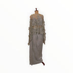 Zari Designs Indo Western crepe outfit featuring a sage green skirt and a sheer embellished cape with floral embroidery.