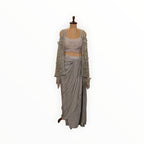 Zari Designs Indo Western crepe outfit featuring a silver embellished crop top, matching shrug, and draped skirt.