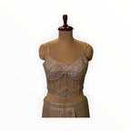 Zari Designs silver embellished corset blouse with intricate beadwork and spaghetti straps on a mannequin