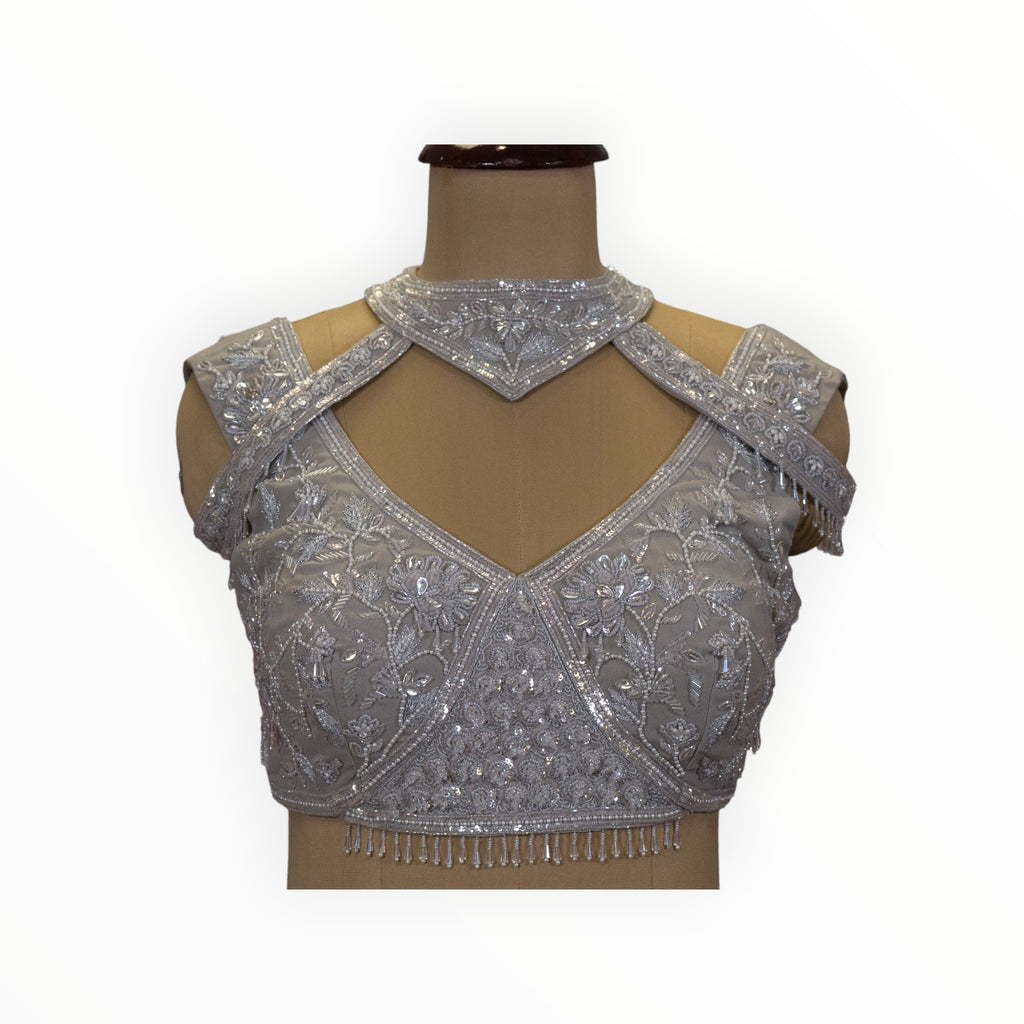 Zari Designs silver georgette ready drape saree blouse with intricate floral embroidery, sequins, and cut-out neck.