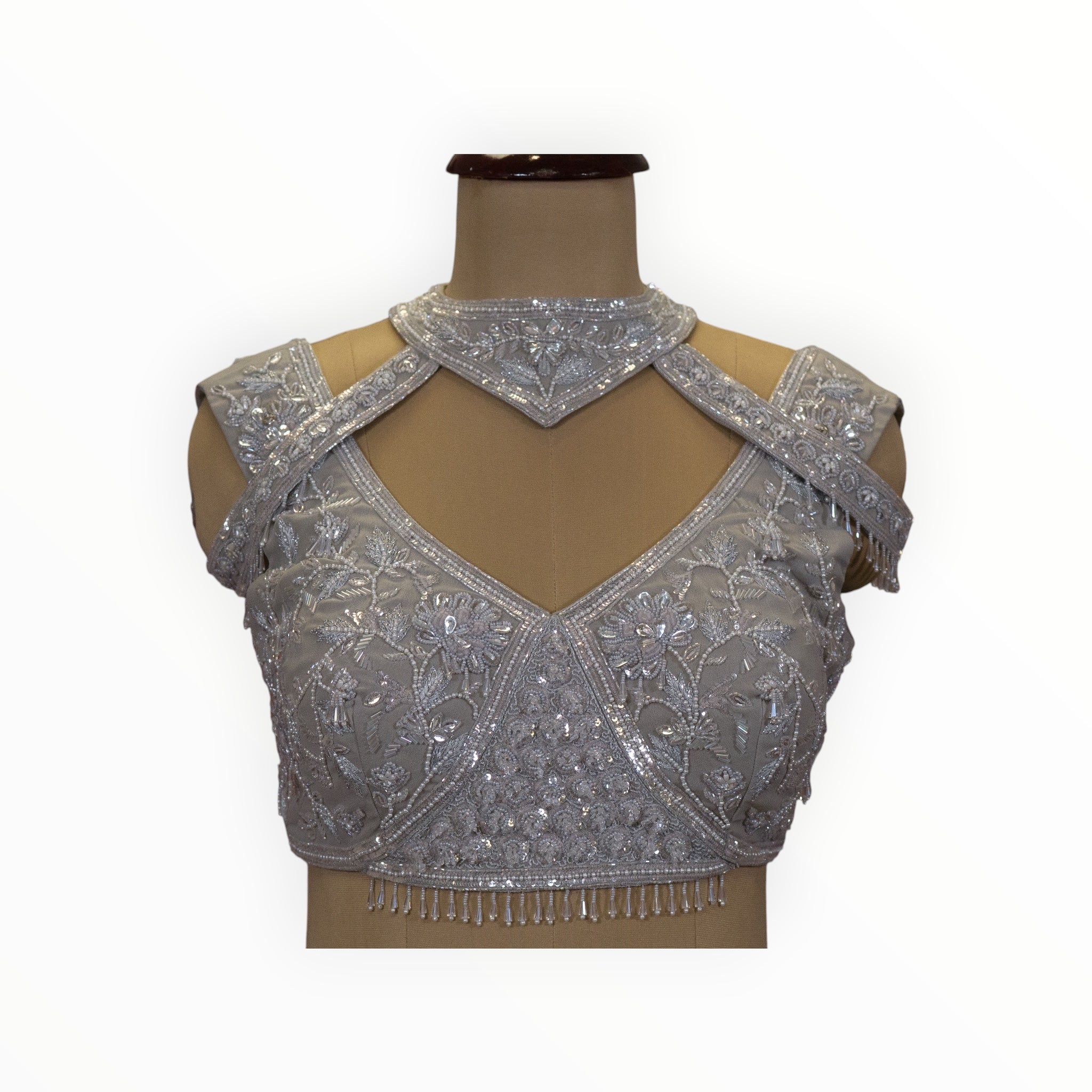 Zari Designs silver georgette ready drape saree blouse with intricate floral embroidery, sequins, and cut-out neck.