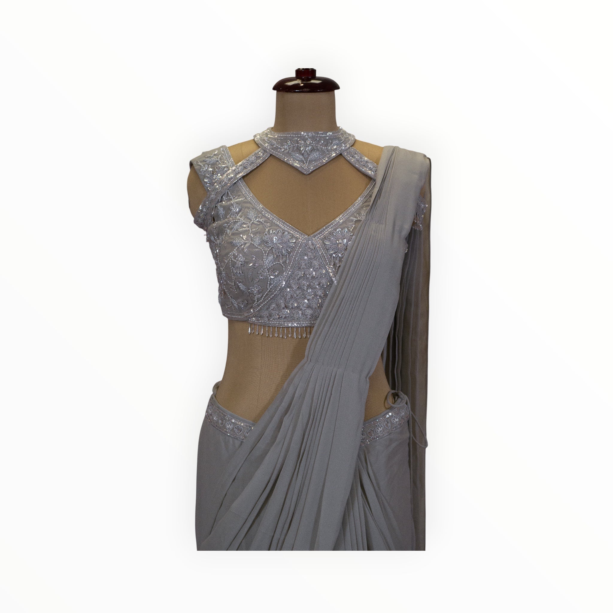 Zari Designs silver georgette ready drape saree with an intricately embroidered sleeveless blouse and choker neckline