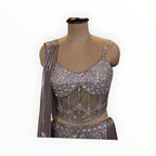 Zari Designs silver corset blouse with intricate sequin embroidery and sheer mesh detailing on a mannequin